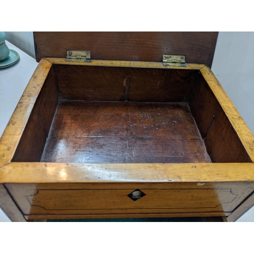 334 - A two drawer birch collectors chest with a hinged lid and inlaid decoration, raised on plinth
Locati... 