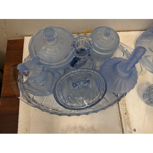 335 - Glassware to include blue glass dressing table items, a figural centre piece, glasses, decanter and ... 