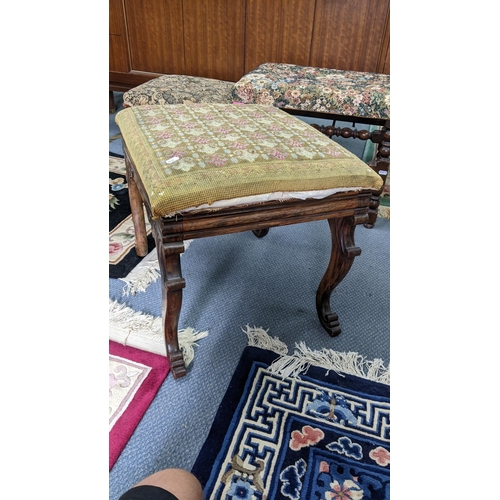 41 - A 19th century tapestry topped footstool having a carved C-scroll frame and on cabriole legs, togeth... 