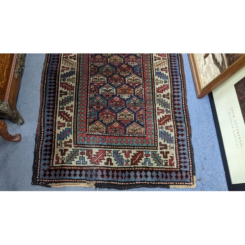 42 - A hand woven Turkish rug having repeating motifs and multiguard borders, 235 x 106, Location: A2M