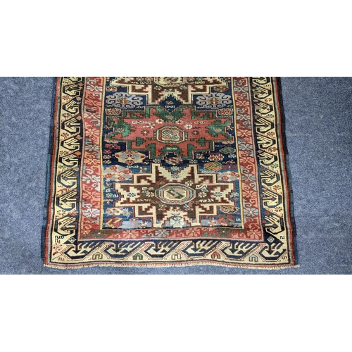 44 - A Turkish hand woven rug having a blue ground with four motifs and beige border, 146 x 104.5, Locati... 