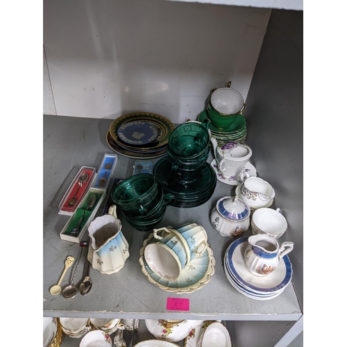 69 - A mixed lot of china and glass to include part teaset, decanters etc, along with silver plated cutle... 