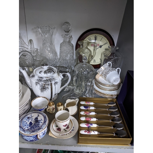 69 - A mixed lot of china and glass to include part teaset, decanters etc, along with silver plated cutle... 