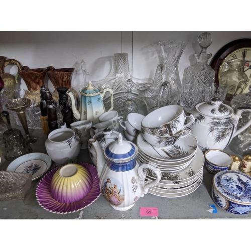 69 - A mixed lot of china and glass to include part teaset, decanters etc, along with silver plated cutle... 