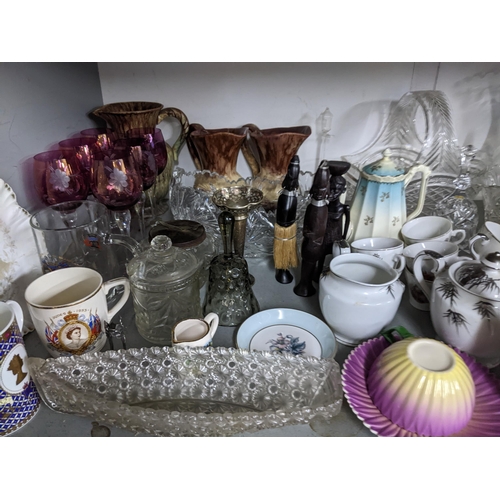 69 - A mixed lot of china and glass to include part teaset, decanters etc, along with silver plated cutle... 