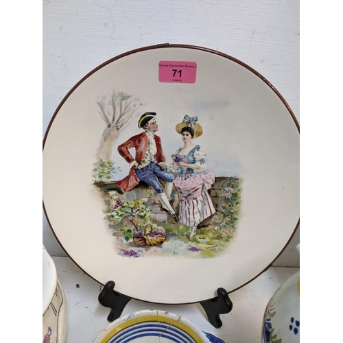 71 - A selection of French Quimper and other ceramics to include a pair of cabinet plates signed B Fremon... 