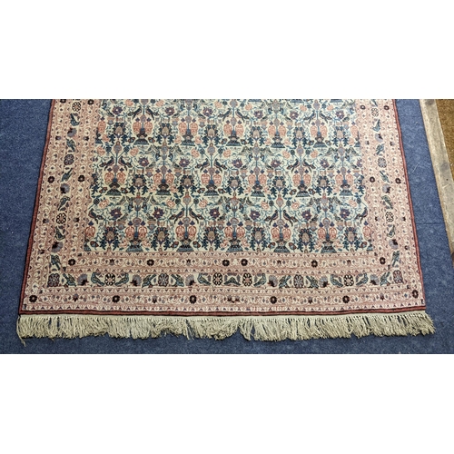 9 - A South East Persian Zili Sultan hand woven rug having an ivory ground and decorated with birds and ... 