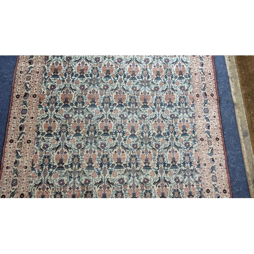 9 - A South East Persian Zili Sultan hand woven rug having an ivory ground and decorated with birds and ... 