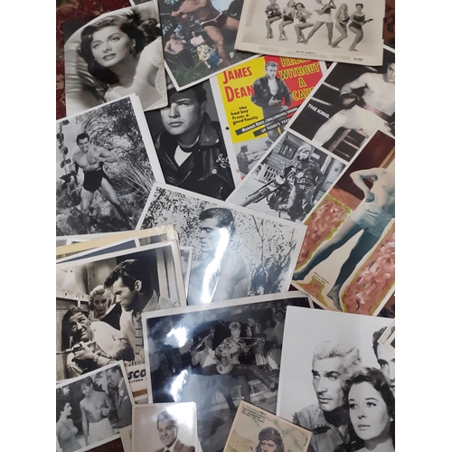 91 - A collection of vintage mainly black and white photographs of film stars and film related stills
Loc... 