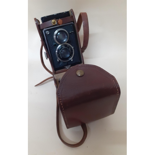 98 - A Rollieflex Compur camera in a brown leather case
Location: RWM