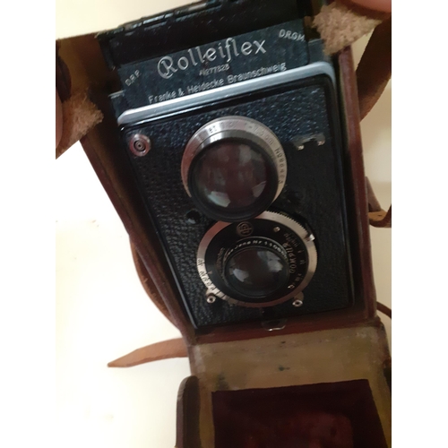 98 - A Rollieflex Compur camera in a brown leather case
Location: RWM