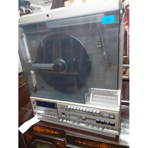 228 - A Mitsubishi vertical X-12 turntable and stereo audio system with radio tuner and cassette deck Loca... 