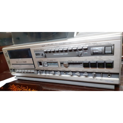 228 - A Mitsubishi vertical X-12 turntable and stereo audio system with radio tuner and cassette deck Loca... 