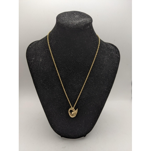 1 - A 9ct gold necklace with a 9ct gold pendant in the form of a swan, total weight 6.6g
Location: CAB2