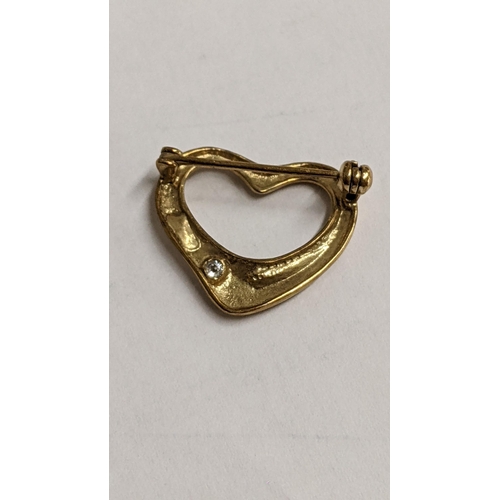 106 - A yellow metal heart shaped brooch inset with a single diamond, 2g
Location: CAB3