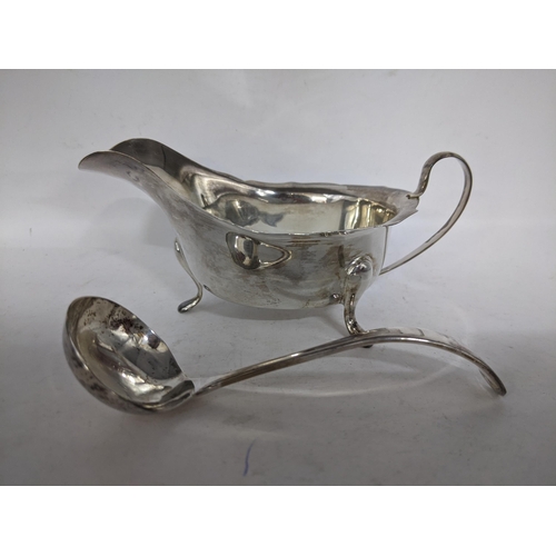 110 - A silver Ladle and sauce boat cased Sheffield 1948 -49 and also 1956 -57 along with a cased set of s... 