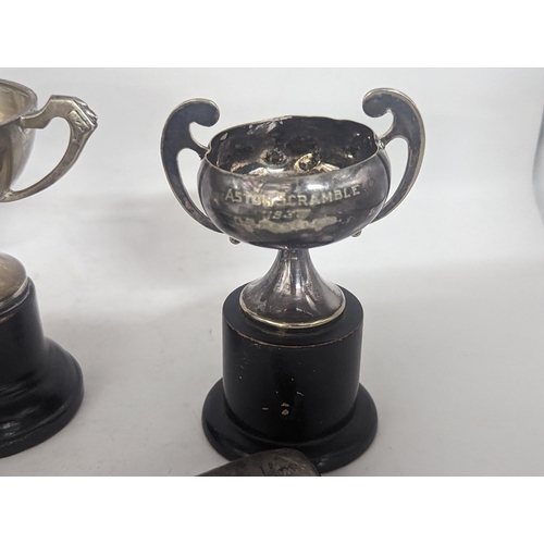 114 - A group of three 1930's trophies to include two silver examples along with a George III early 19th c... 