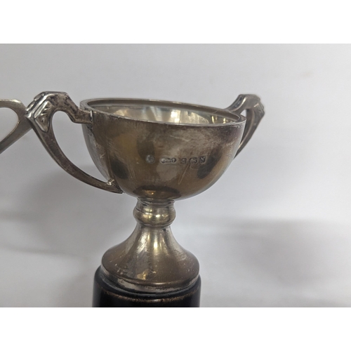 114 - A group of three 1930's trophies to include two silver examples along with a George III early 19th c... 