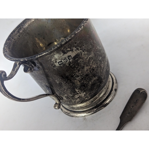 115 - An early 20th century silver cup engraved with monogram and hallmarked London 1910, together with a ... 