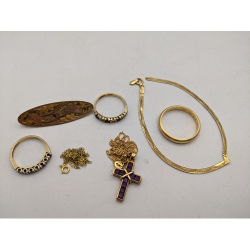 262 - 9ct gold jewellery to include three rings some set with semi-precious stones, a cross and chain set ... 