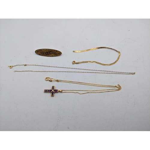 262 - 9ct gold jewellery to include three rings some set with semi-precious stones, a cross and chain set ... 