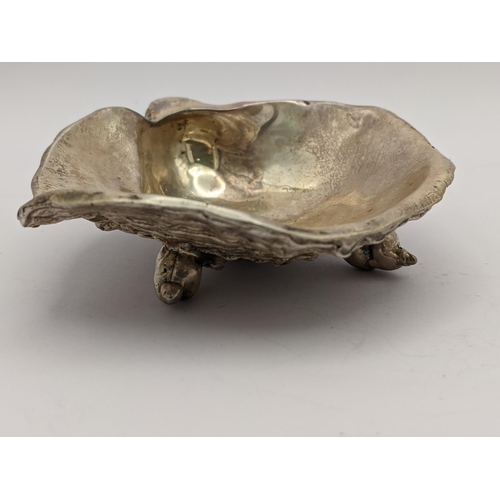 269 - A mid 20th century silver oyster shell design silver salt, by William Comyns & Sons Ltd, 105.5g
Loca... 