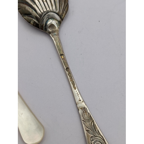 272 - A group of mixed silver items to include a silver sugar sifter soon, a shell caddy spoon, one other ... 