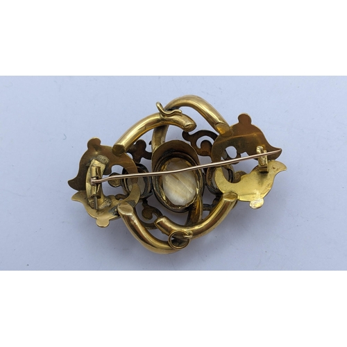 276 - A Victorian pinchbeck brooch having three faceted cut Citrines in a scrolled frame
Location: CAB5