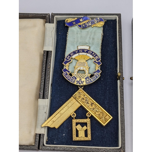 278 - A pair of cased Masonic medals to include a 9ct gold and enamel Orion Lodge example with 9ct gold an... 