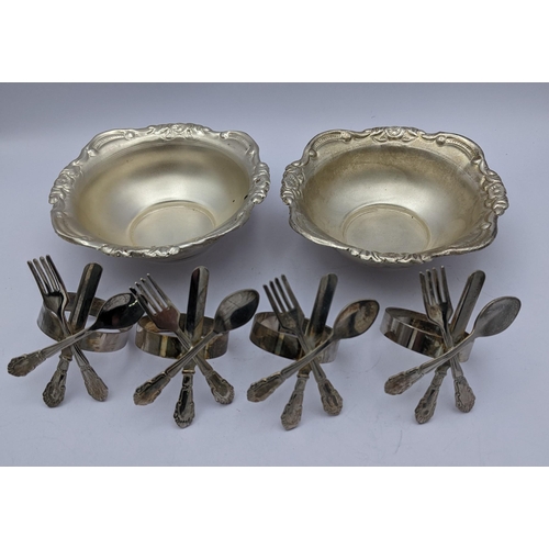 279 - White metal items to include a pair of bowls having embossed floral rims, inscribed 'silver' to the ... 