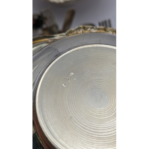 279 - White metal items to include a pair of bowls having embossed floral rims, inscribed 'silver' to the ... 