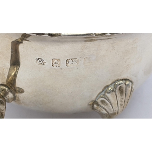 281 - An early 20th century silver sauce boat raised on three legs hallmarked Birmingham 1935, 176.9g
Loca... 