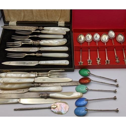 284 - A selection of silver and white metal cutlery to include a set of five enamelled coffee spoons
Locat... 