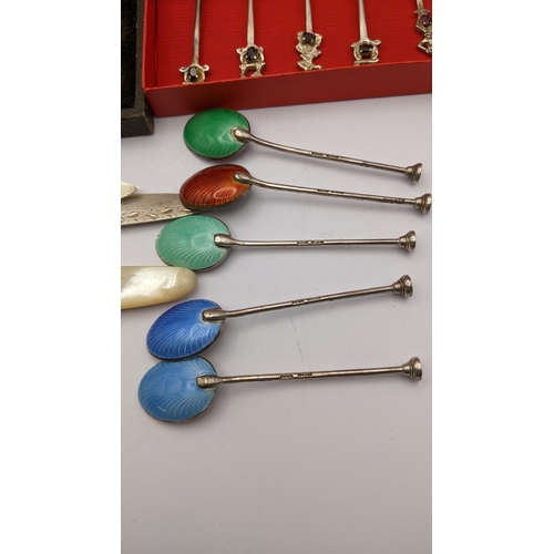 284 - A selection of silver and white metal cutlery to include a set of five enamelled coffee spoons
Locat... 