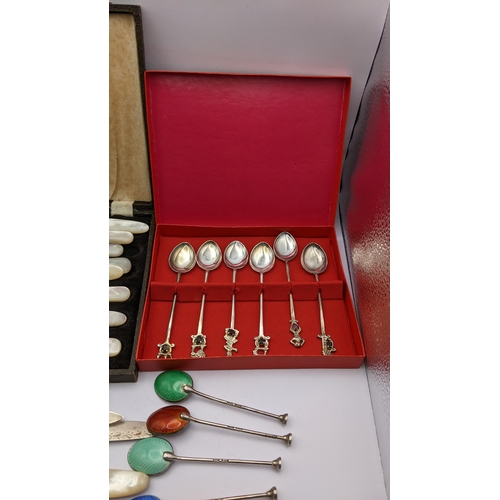 284 - A selection of silver and white metal cutlery to include a set of five enamelled coffee spoons
Locat... 