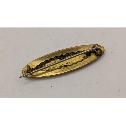 30 - A Victorian yellow metal 'mother' brooch of oval shape and having beaded decoration 3.8g
Location: C... 