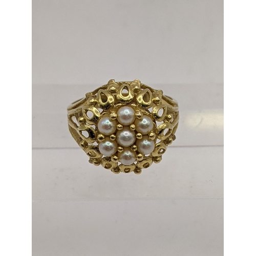 44 - A yellow metal cluster style ring set with pearls, tested as 18ct gold, 5.1g Location: RING