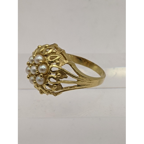 44 - A yellow metal cluster style ring set with pearls, tested as 18ct gold, 5.1g Location: RING