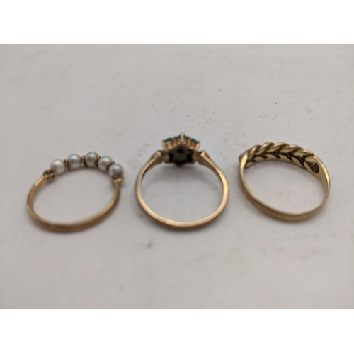 50 - Three 9ct gold rings, one set with five small pearls, another set with non-precious stones in the sh... 