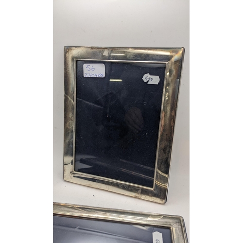 56 - Three large silver photograph frames to include one having a reeded border and easel backs
Location:... 