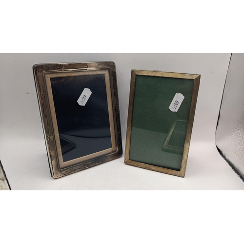 57 - Four silver photograph frames to include one having an engine turned border, hallmarked Birmingham 1... 