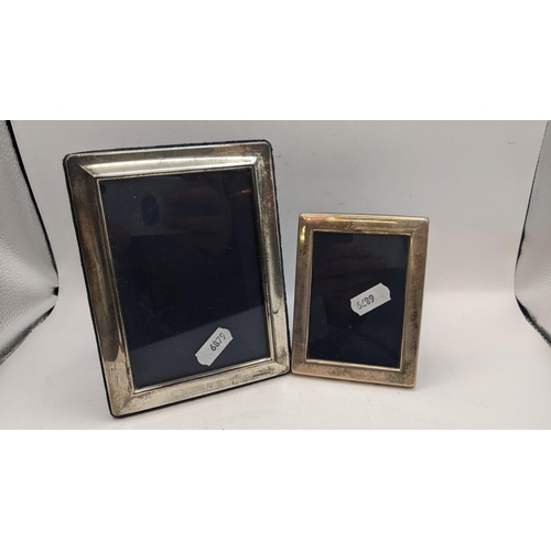 57 - Four silver photograph frames to include one having an engine turned border, hallmarked Birmingham 1... 