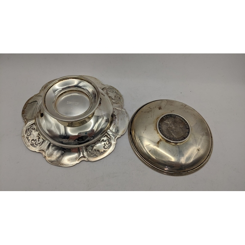 59 - A silver pin dish inset with a 1965 Churchill crown 75.1g, together with a Mappin & Webb silver pier... 