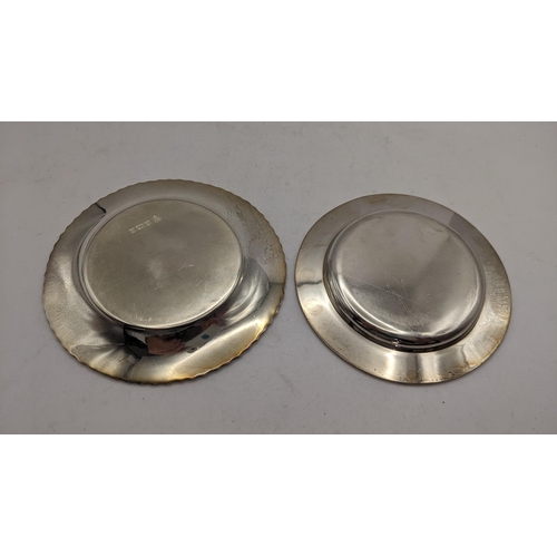 62 - Two silver pin dishes to include one having a gadrooned rim, hallmarked Birmingham 1974, total weigh... 