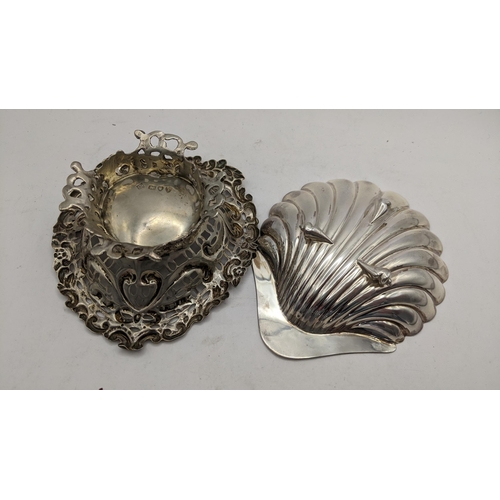 63 - A late Victorian silver pierced heart shaped dish together with a silver shell shaped butter dish, t... 