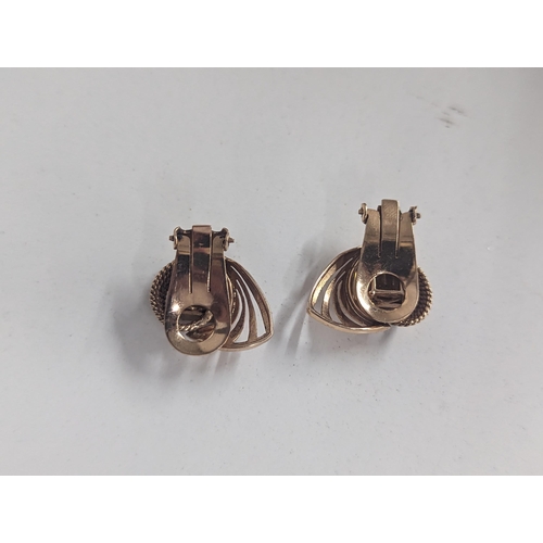 83 - A pair of stamped 18 gold, Art Deco inspired earrings inset with central citrinin, 11.1g, total weig... 