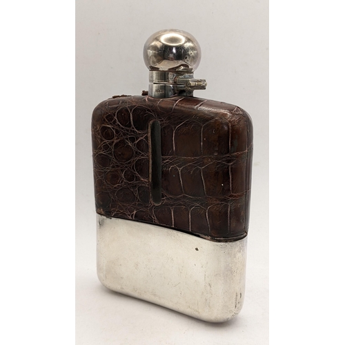 89 - An early 20th century silver plated and crocodile leather hip flask
Location: 4.1