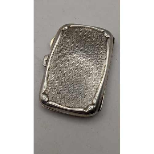 91 - A 1920's silver cigarette case having engine turned body and empty cartouche, hallmarked Birmingham ... 