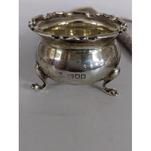 92 - Silver items to include a napkin rings, a salt dish, an elaborately pierced and decorated trinket di... 