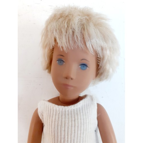 Sasha-A 1970's Trendon Gregor boy doll created by Sasha Morgenthaler having white/light blonde hair, white tank top, blue jeans, white socks and sneakers, 16" High.
Location: R1.2